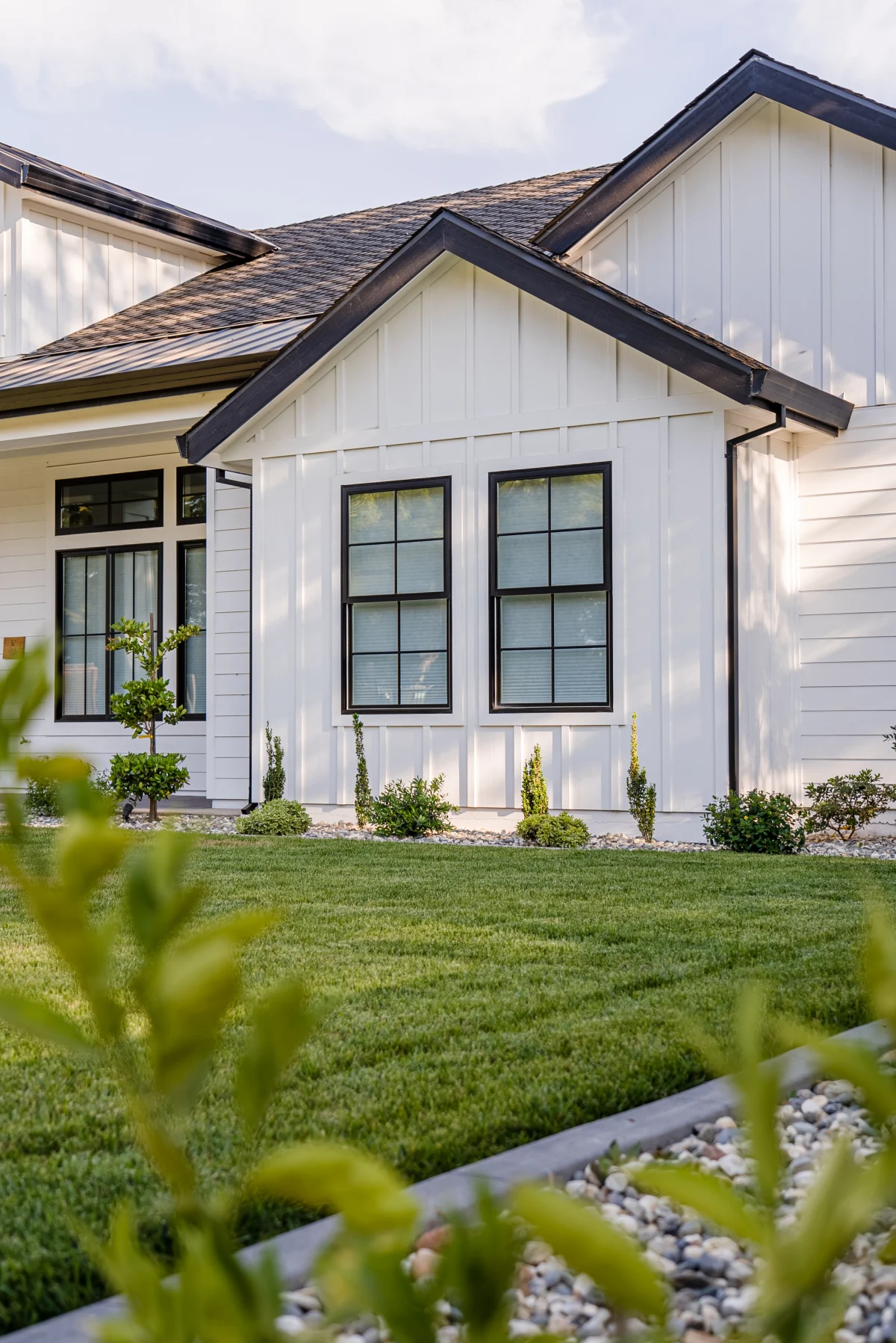 White farmhouse corner with board-and-batten siding