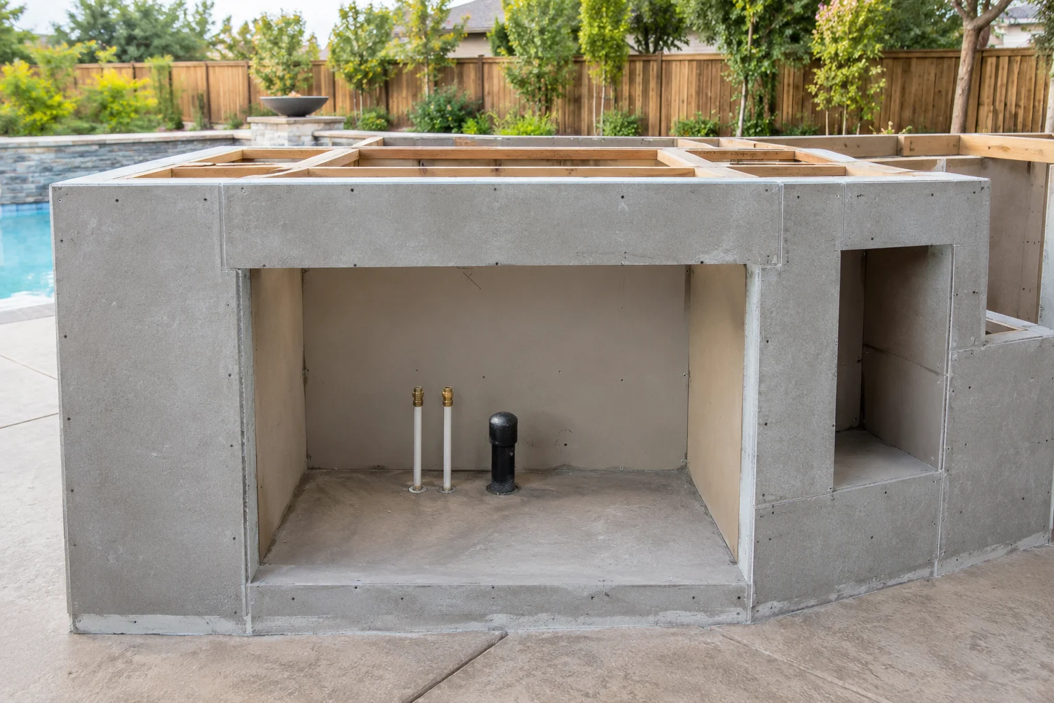 Outdoor kitchen base with an opening for a grill