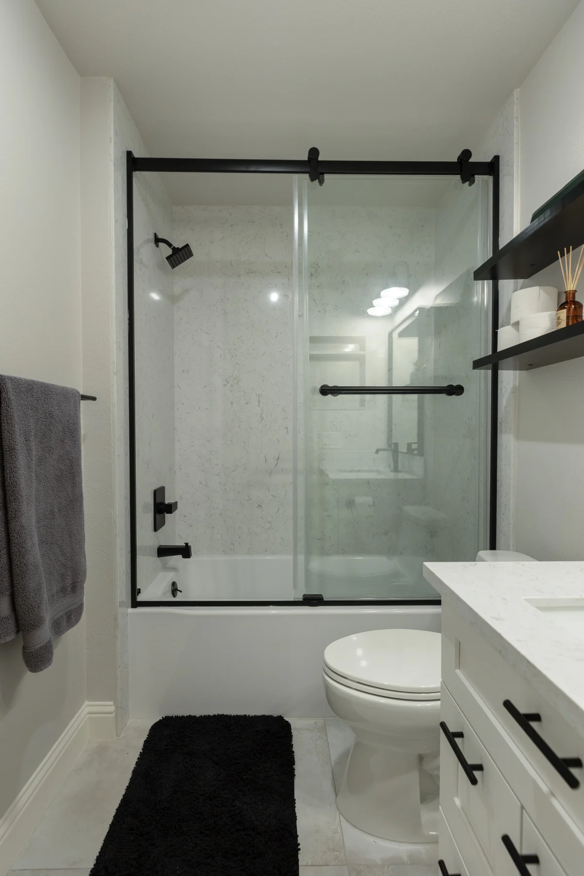 Bathroom with a sliding glass tub door