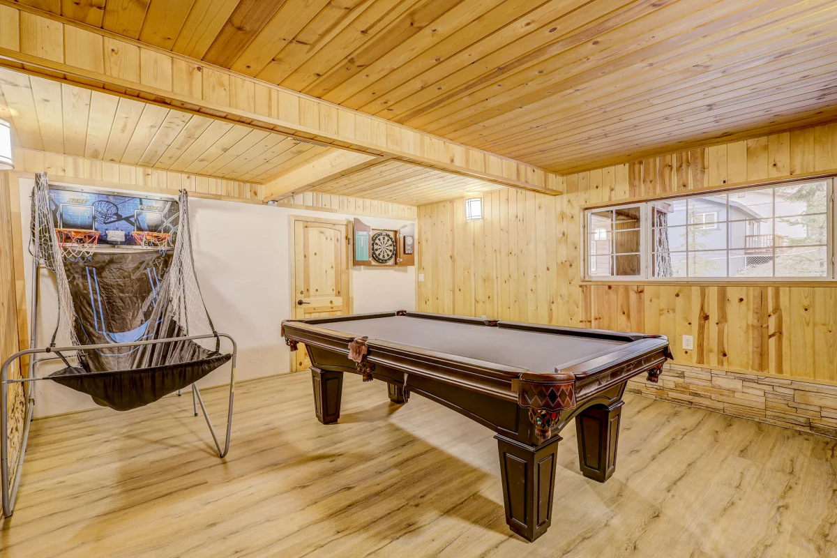 Game room with a pool table and a wood plank ceiling