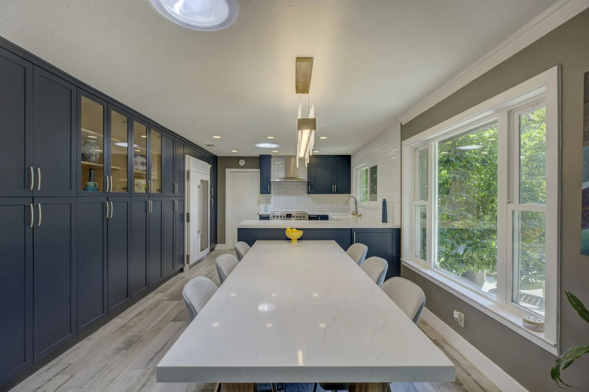 Kitchen with navy cabinets and a long white island
