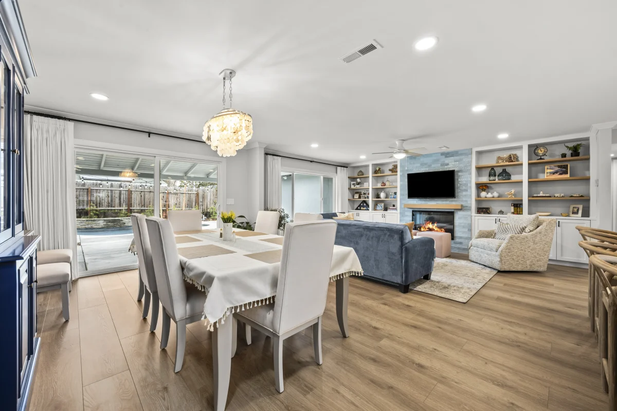 Open dining and living room with built-in shelves