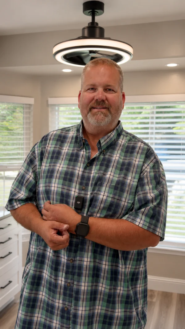 Homeowner standing in a remodeled kitchen