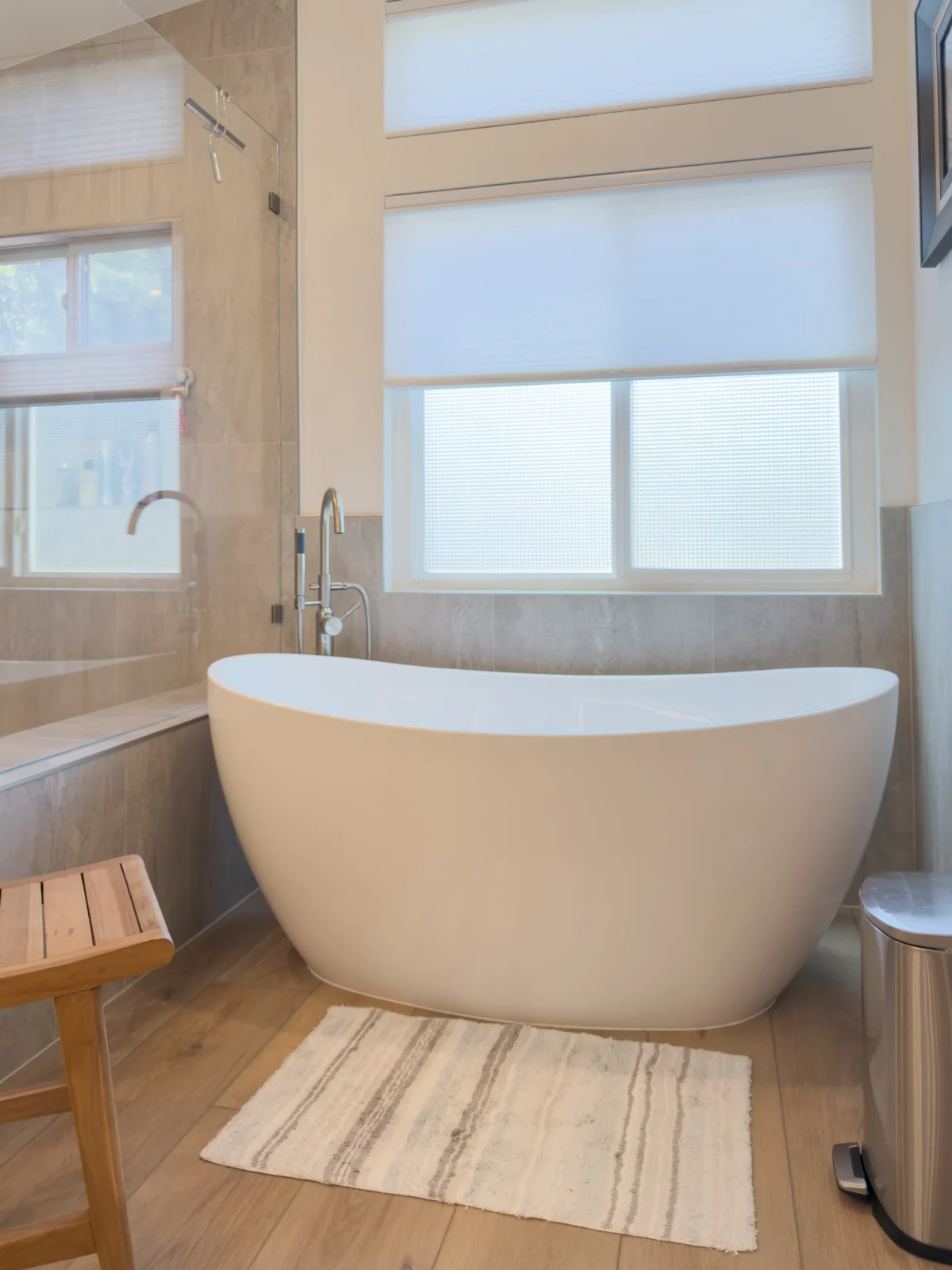 Freestanding tub under a frosted window