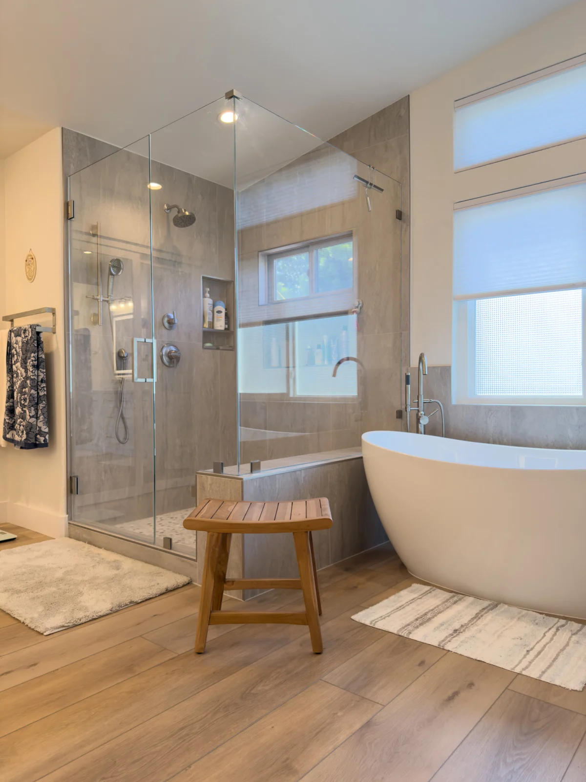 Bathroom with a freestanding tub and a glass shower