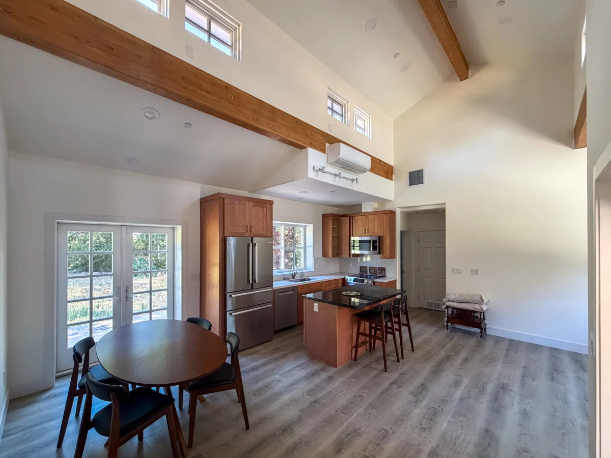 Unit interior with wood beams and a kitchen