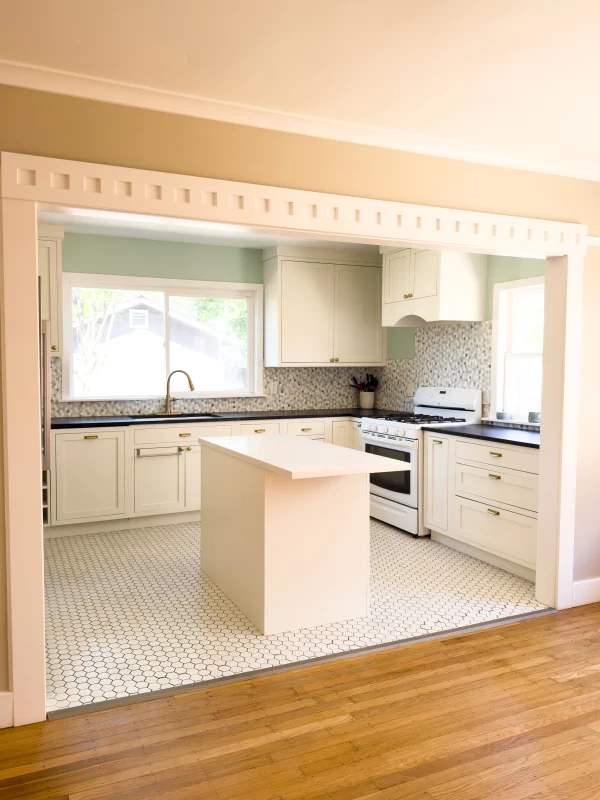 Kitchen seen through a doorway with a small island