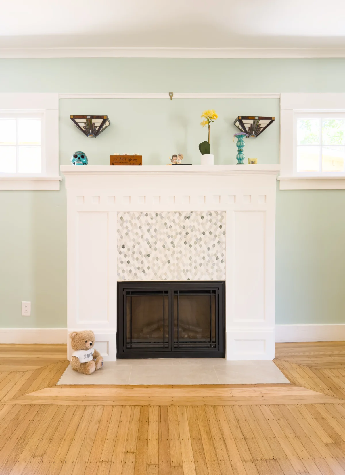 White fireplace with a tile surround