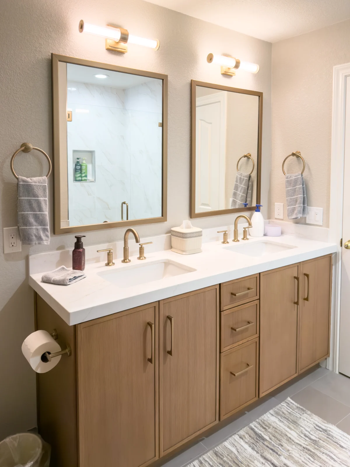 Bathroom with a wood double vanity and two mirrors