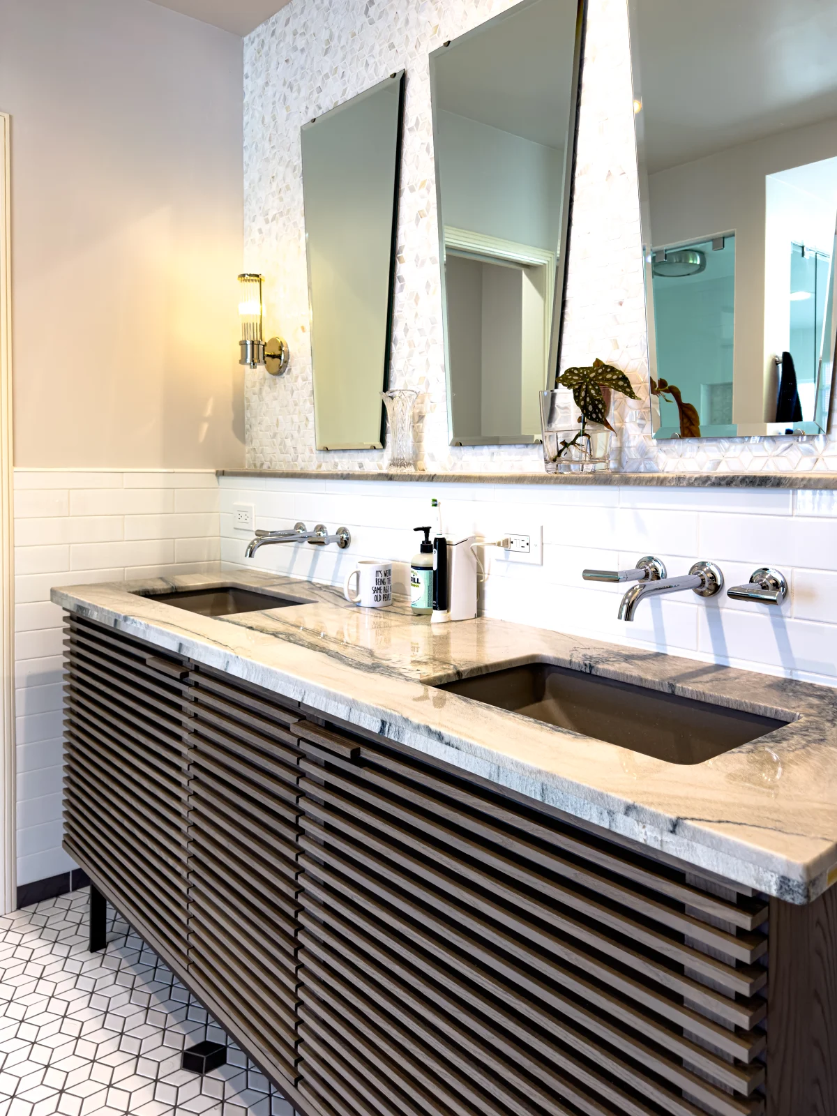 Bathroom with a slatted wood vanity and two mirrors