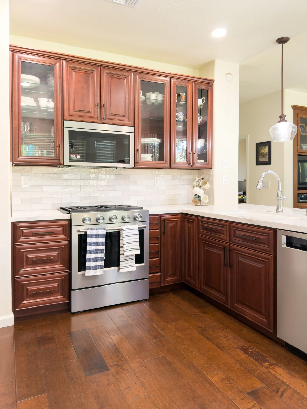 Kitchen with cherry wood cabinets and stainless appliances