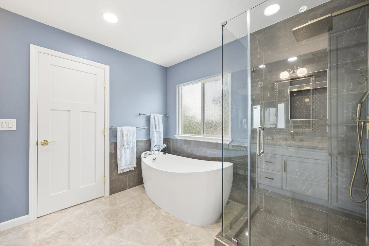 Bathroom with a freestanding tub and glass shower