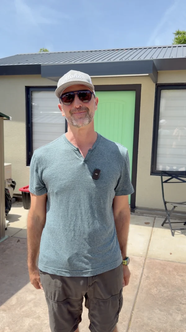 Homeowner standing outside a backyard unit