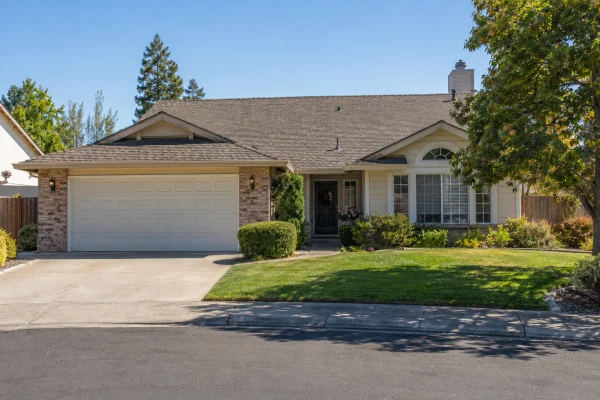 Single-story house with a weathered composition shingle roof