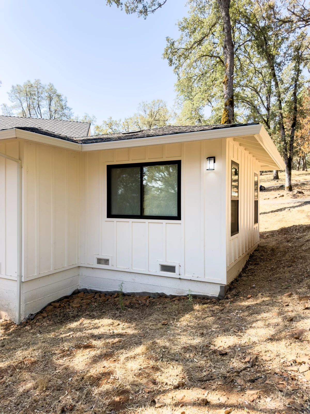 Single-story addition on a hillside lot
